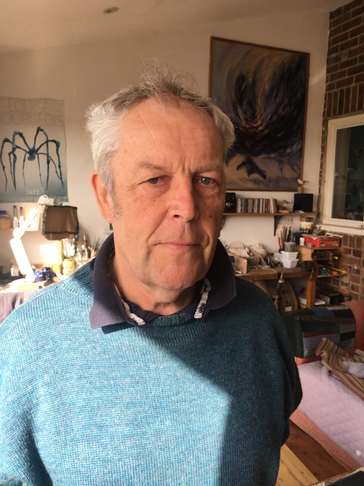 Photo of Chris Heape in a blue jumper.